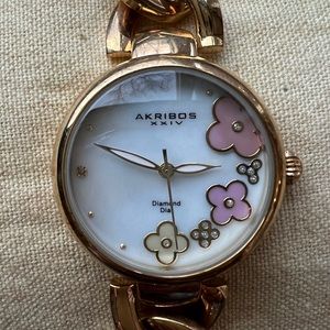 Gold tone Akribos watch bracelet